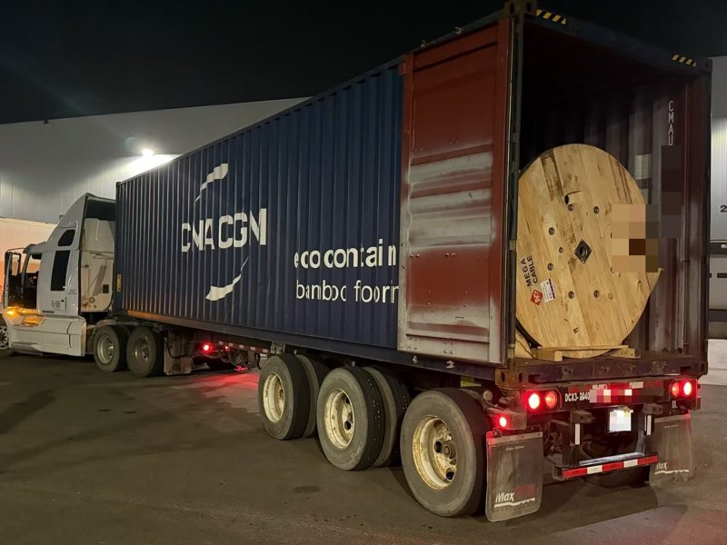 Container opened at the warehouse for unloading.