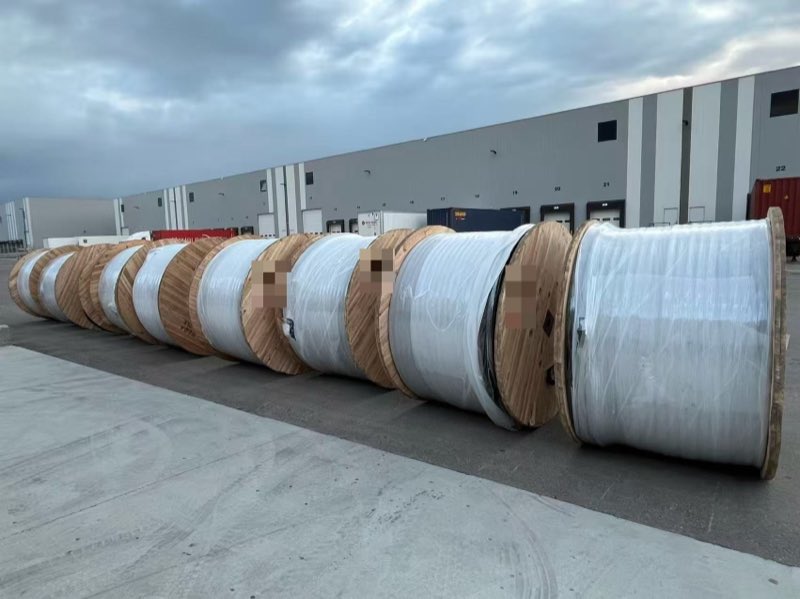 Wrapped reels lined up after unloading.