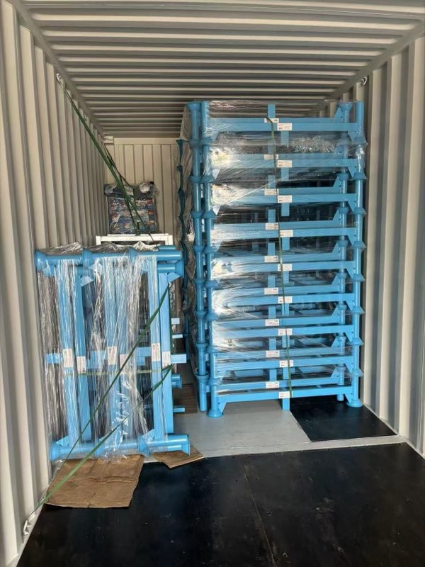 The custom stackable racks secured in the container.